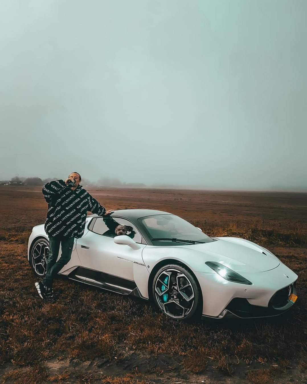 There are two types of people in this world..  Those that pose next to a cool car …and those that pose next to a cool car with a poodle locked inside🐩
